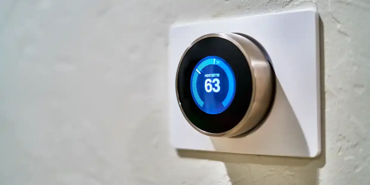 Smart thermostat mounted on a wall