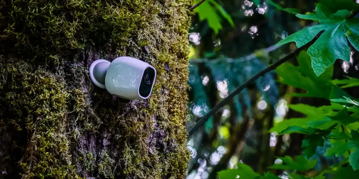Outdoor home security camera mounted on a house exterior